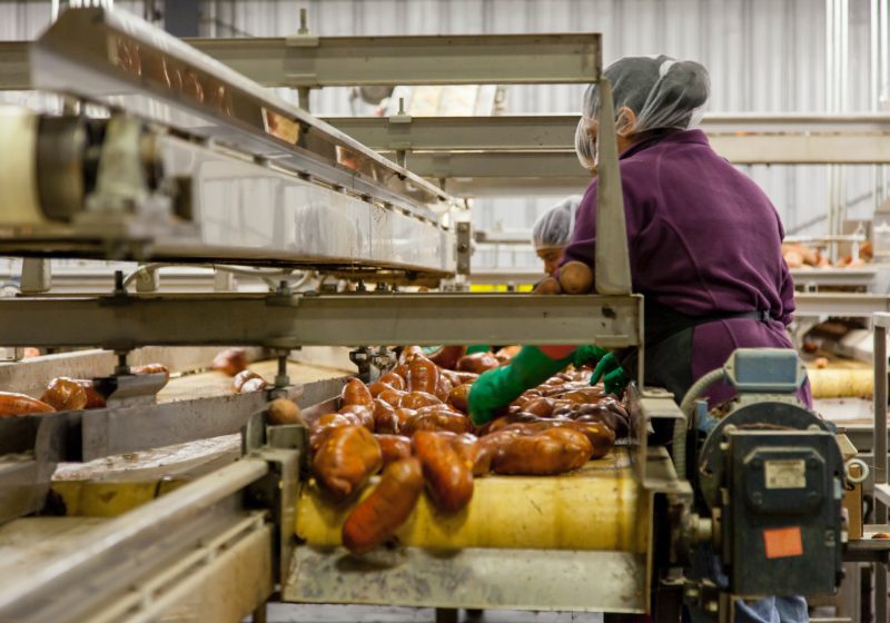 A woman works in a food processing plant in Macon.