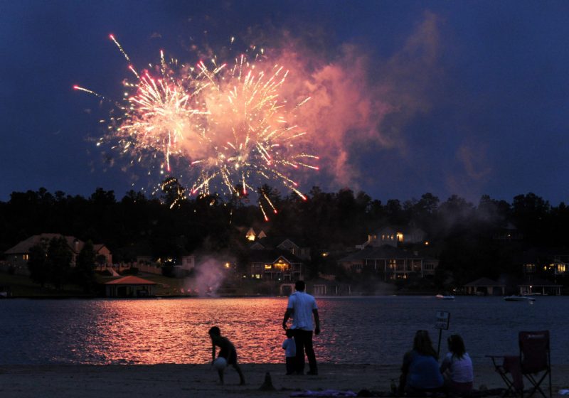 A firework show over a lake.