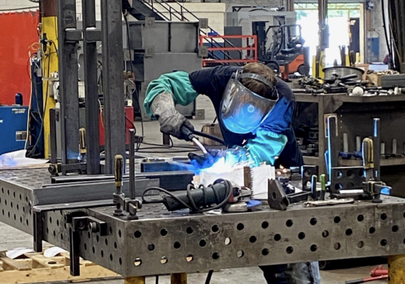 A person welding.